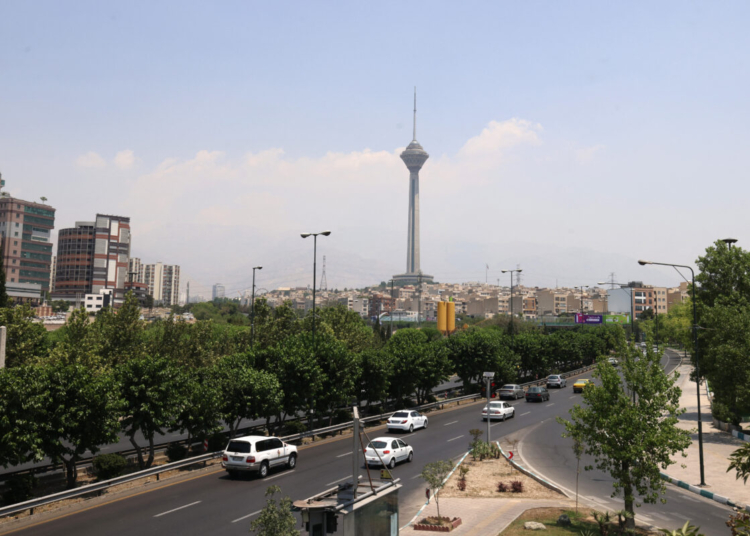 A general view shows the Milad Telecommunications Tower in Iran's capital Tehran on June 14, 2025. Israel's military said that its fighter jets were set to resume striking targets in Tehran, after announcing it had hit air defences in the Iranian capital area overnight, as Israel and Iran trade fire with such intensity for the first time following decades of enmity and conflict by proxy, with fears of a prolonged conflict engulfing the region. (Photo by Atta KENARE / AFP)