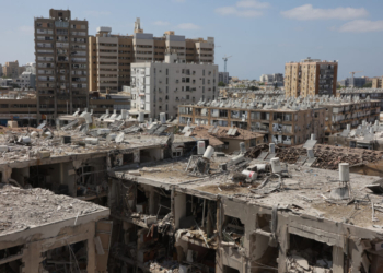 A general view shows heavily damaged buildings, following an overnight iranian missile strike in bat yam on june 15, 2025. Israeli prime minister benjamin netanyahu said that iran would pay "a very heavy price" for killing israeli civilians, during a june 15 visit to the site of a missile strike on a residential building near tel aviv, as the two foes kept up intense fighting. (photo by gil cohen-magen / afp)