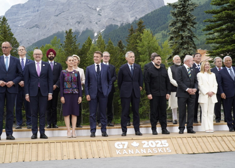 (L/R, top row) US Secretary of Treasury Scott Bessent, World Bank President Ajay Banga, European Commission President Ursula Von der Leyen, British Prime Minister Keir Starmer, South Korean President Lee Jae-myung, South African President Cyril Ramaphosa, Indian Prime Minister Narendra Modi, Japanese Prime Minister Shigeru Ishiba, UN Secretary General Antonio Guterres, NATO Secretary General Mark Rutte, (L/R, bottom row) German Chancellor Friedrich Merz, Australian Prime Minister Anthony Albanese, Mexican President Claudia Sheinbaum, French President Emmanuel Macron, Canadian Prime Minister Mark Carney, Ukrainian President Volodymyr Zelensky, Brazilian President Luiz Inacio Lula da Silva, Italian Prime Minister Giorgia Meloni and European Council President Antonio Costa pose for a family photo during the Group of Seven (G7) Summit at the Kananaskis Country Golf Course in Kananaskis, Alberta, Canada on June 17, 2025. (Photo by Geoff Robins / AFP)