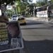 A man shows the front page of a newspaper reading "Make Venezuela great again" and depicting US President Donald Trump and Venezuela's ousted president Nicolas Maduro in Cucuta, Colobia, on the border with Venezuela, on January 4, 2026, a day after a US strike. The government of Colombia announced Saturday that it is preparing to declare an economic state of emergency on the border with Venezuela following the United States attacks in that country and the capture of its president, Nicolas Maduro, in the early hours of the morning. (Photo by Schneyder Mendoza / AFP)