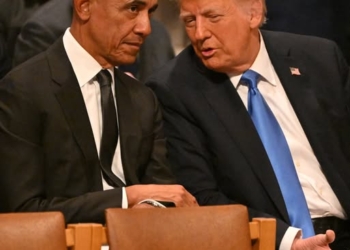 (FILES) Former US President Barack Obama speaks with President-elect Donald Trump before the State Funeral Service for former US President Jimmy Carter at the Washington National Cathedral in Washington, DC, on January 9, 2025. US President Donald Trump triggered outrage on February 6, 2026, after he posted a video depicting Barack Obama, the first Black president in American history, and his wife Michelle as monkeys. The White House said Friday that the post was made in error by a staff member, and has bee