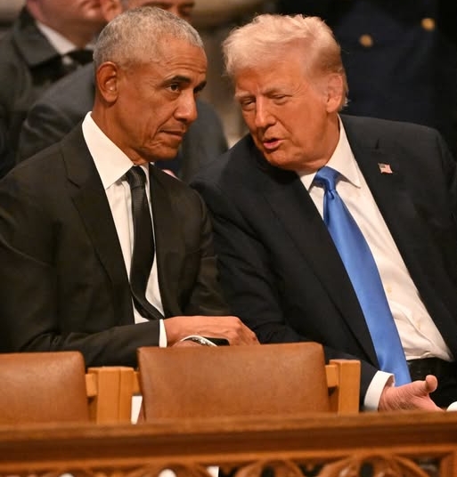 (FILES) Former US President Barack Obama speaks with President-elect Donald Trump before the State Funeral Service for former US President Jimmy Carter at the Washington National Cathedral in Washington, DC, on January 9, 2025. US President Donald Trump triggered outrage on February 6, 2026, after he posted a video depicting Barack Obama, the first Black president in American history, and his wife Michelle as monkeys. The White House said Friday that the post was made in error by a staff member, and has bee