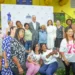 El presidente luis abinader y la directora general de supérate, mayra jimenez, junto a las madres en el acto del el bono madres 2026